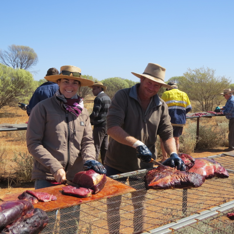 Meja Aldrich prepares baits on an outdoor table